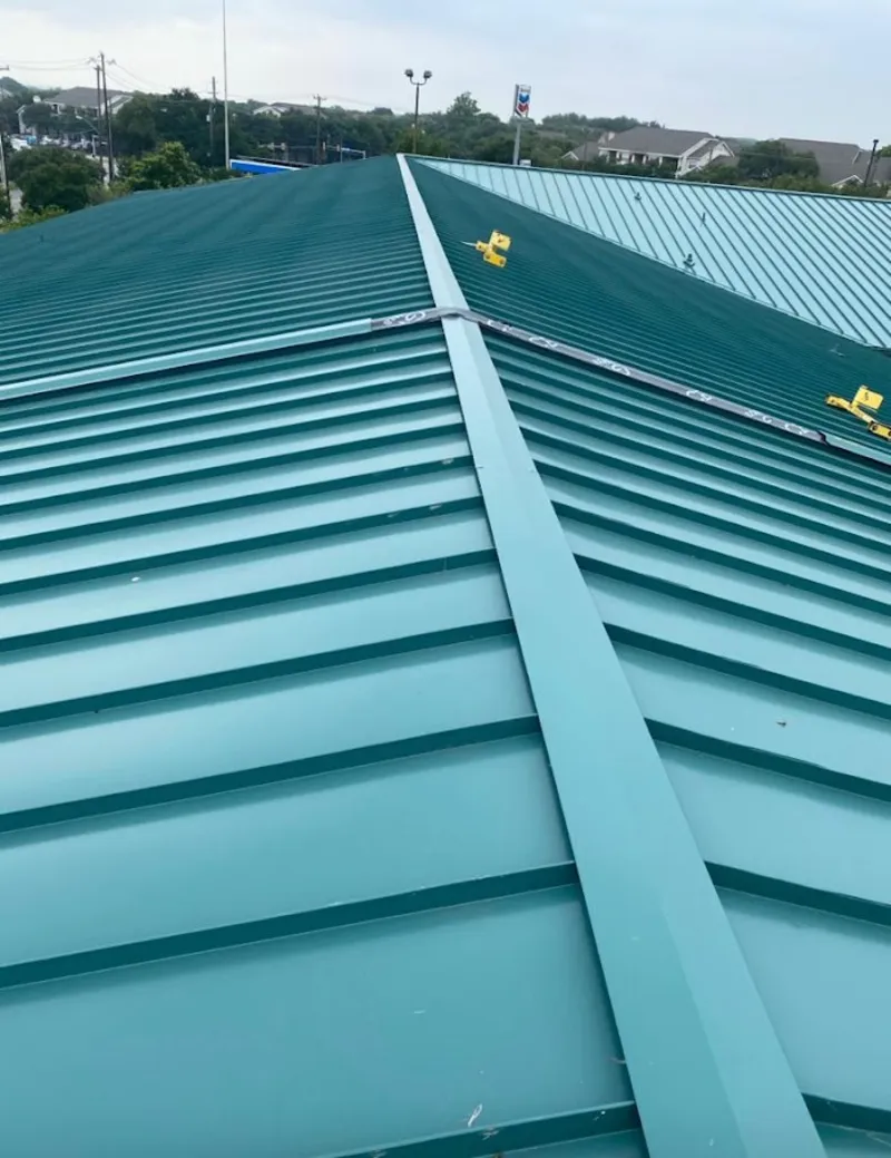 Green commercial metal roof ridge and valley for Metal Roof Repair in Pebble Creek